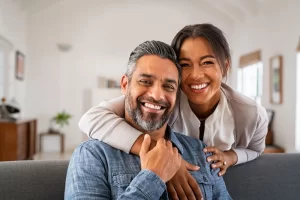 Happy couple smiling after dental care