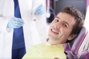 Male patients getting his teeth checked by dentist